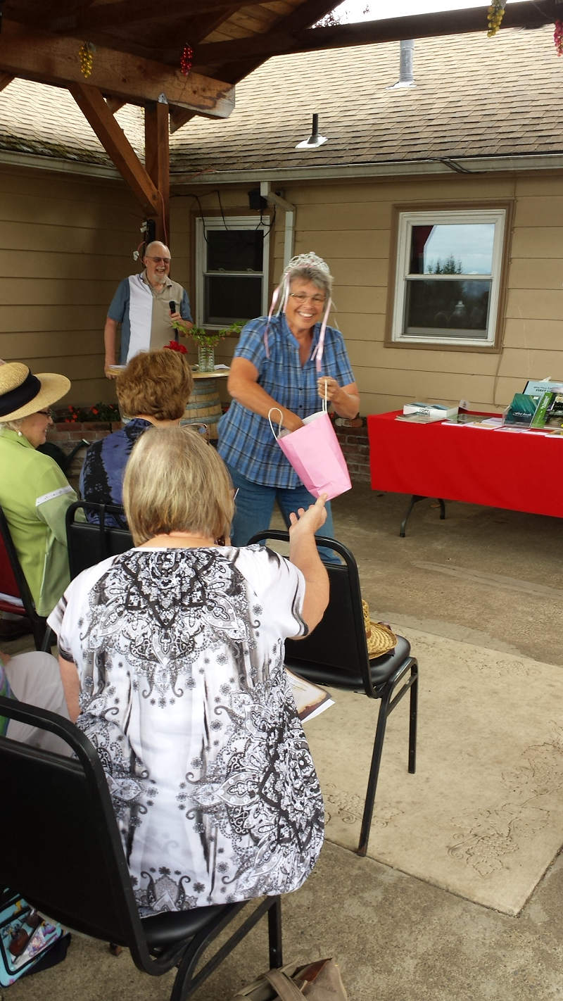 Lend an Ear 2015 - Susan Schmidlin distributes goodies after her reading to the audience.